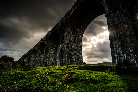 The Creeping Light: by a cloudy and rainy afternoon in a short instant the Sun succeeded to unfold its Light on the land under the Viaduct, Newry, County Down, Northern Ireland, United Kingdom