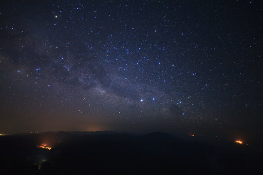 Milky Way Galaxy with lighting on the road at Doi inthanon Chiang mai, Thailand.