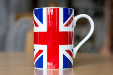Great Britain flag on a mug close up with blurry background
