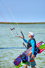 Kite Surfing on waves at sea in summer.