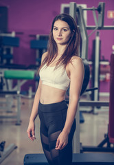 Active young fit woman with perfect body pose