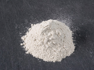 Zeolite  natural raw powder on black  background