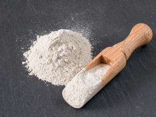 Zeolite  natural raw powder on black  background.