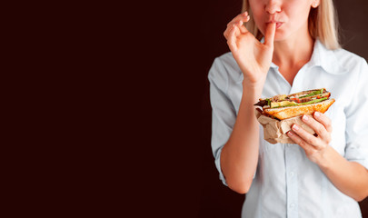 sandwich in the hands of a girl