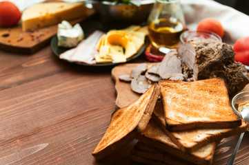meat, toast and vegetables for a sandwich