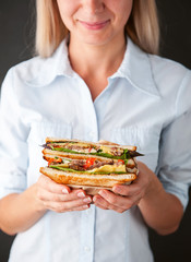 girl looks at a delicious sandwich