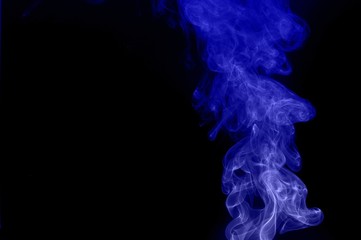 Fototapeta premium movement of smoke, abstract blue smoke on black background, smoke background ,blue smoke background, blue ink