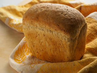 loaf of black bread on a table
