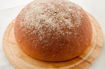 loaf of black bread on a table