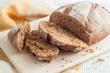loaf of black bread on a table
