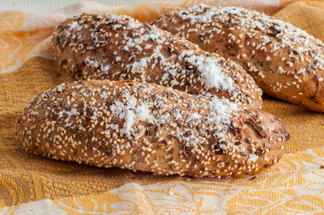 loaf of black bread on a table