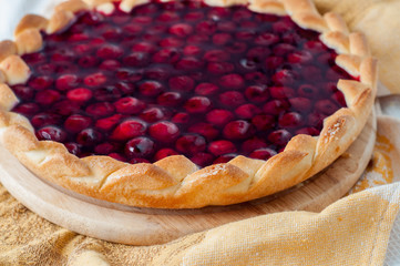 Berry sweet round pie on a table napkin