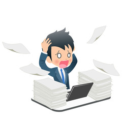 仕事に追われるスーツ姿の若い男性ビジネスマン