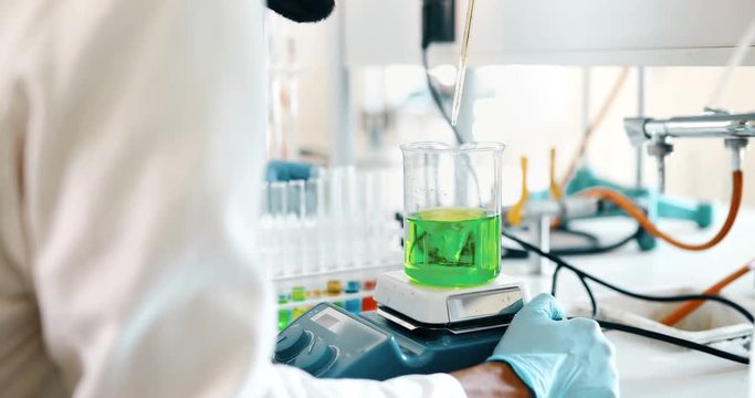 Attractive student of chemistry working in lab