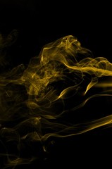 Gold smoke on black background,movement of gold smoke, Abstract gold smoke on black background, gold background,gold ink background,yellow smoke,Glittering gold smoke tail