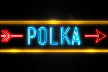 Fototapeta na wymiar Polka - fluorescent Neon Sign on brickwall Front view