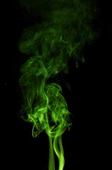Green colored smoke on a black background, abstract cloud. Smoke design,Abstract green lighting,Green Smoke