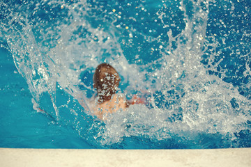 Splashes in the swimming pool.