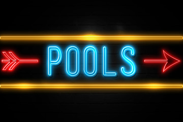 Pools  - fluorescent Neon Sign on brickwall Front view