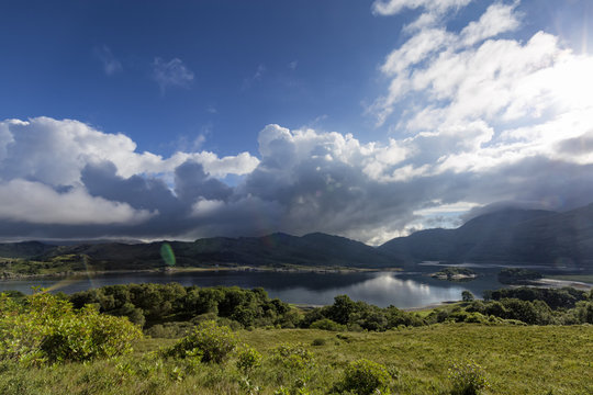 Early morning clouds gather around Rois-Bheinn Mountain next to Loch Ailort in Roshven, Scotland.