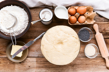 the cook makes dough next to the ingredients