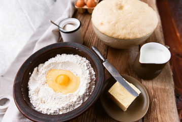 the cook makes dough next to the ingredients