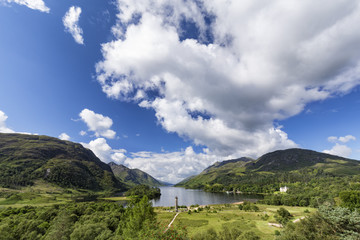 The Glenfinnan monument and Loch Shiel in the background on summer morning in Scotland.