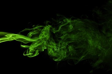 Green colored smoke on a black background, abstract cloud. Smoke design,Abstract green lighting,Green Smoke