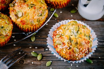 muffins with spinach,  feta cheese pumpkin seeds and sesame seeds