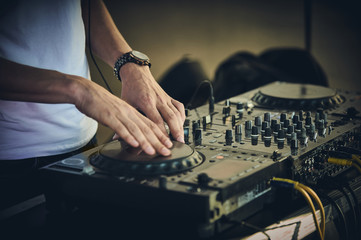 DJ's hands and turntable