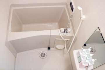 A small bathtub in a small bathroom
