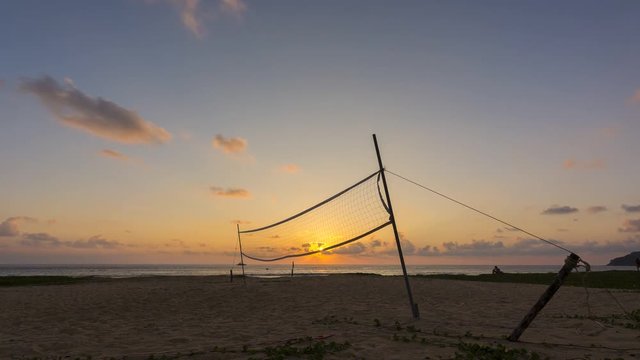 4K Time - Lapse Volleyball net on the beach with beautiful sunset in sport concept.