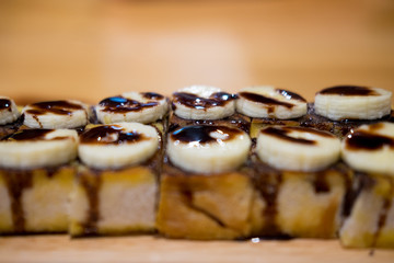 Toasted topped with chocolate and banana