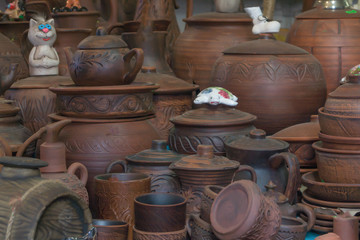 Many brown clay pots in the counter