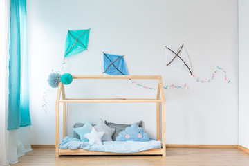 Obraz na płótnie Canvas Bed with star shaped pillows