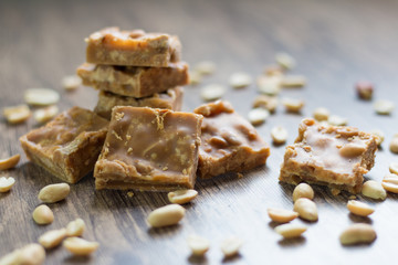 Pieces of peanut caramels on the table