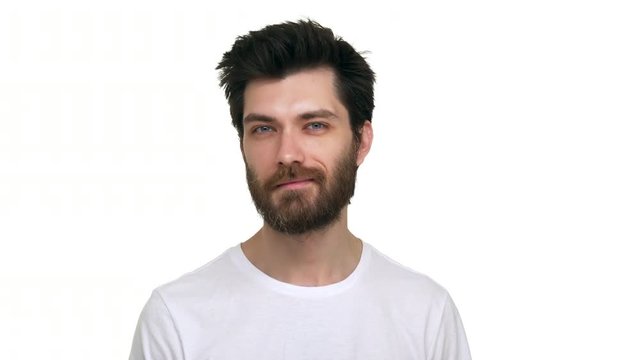 Caucasian male looking straight nodding with affection on white background