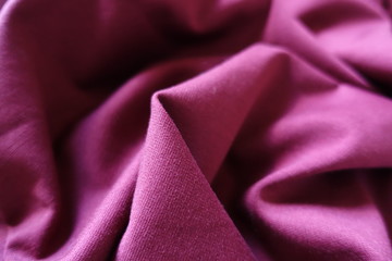 Ruby colored stockinette fabric in soft folds