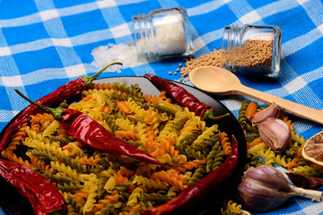 delicious colorful italian pasta with different ingredients for cooking