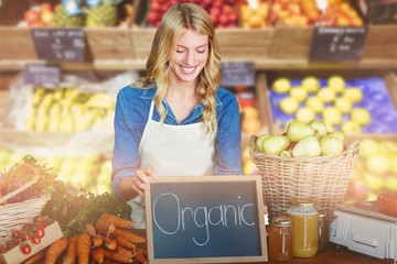 Composite image of young woman with food standing at table