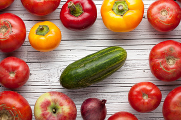 organic farm tomatoes on wooden background  top view, frame, copy space
