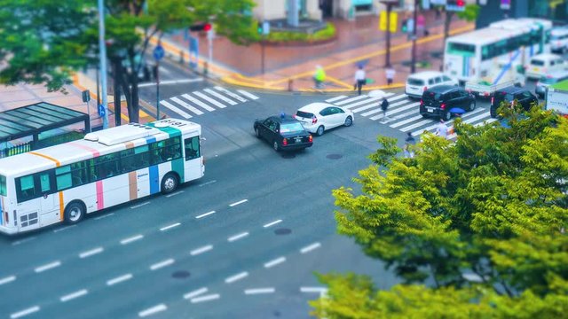 Time-lapse of city intersection. Diorama-like Cars and pedestrians moving

