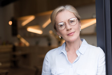 pensive woman in eyeglasses