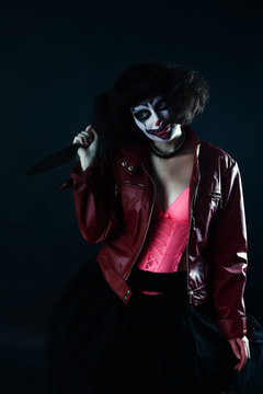 model with makeup scary clown with knife