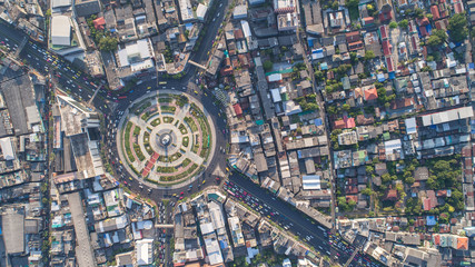 Aerial view, Road roundabout, Expressway with car lots in the city in Thailand.  beautiful Street , downtown, cityscape, Top view. Background