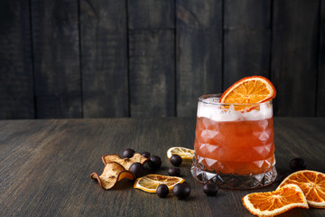 Blood orange margarita cocktail at wooden background