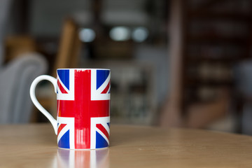 Great Britain flag on a mug close up with blurry background