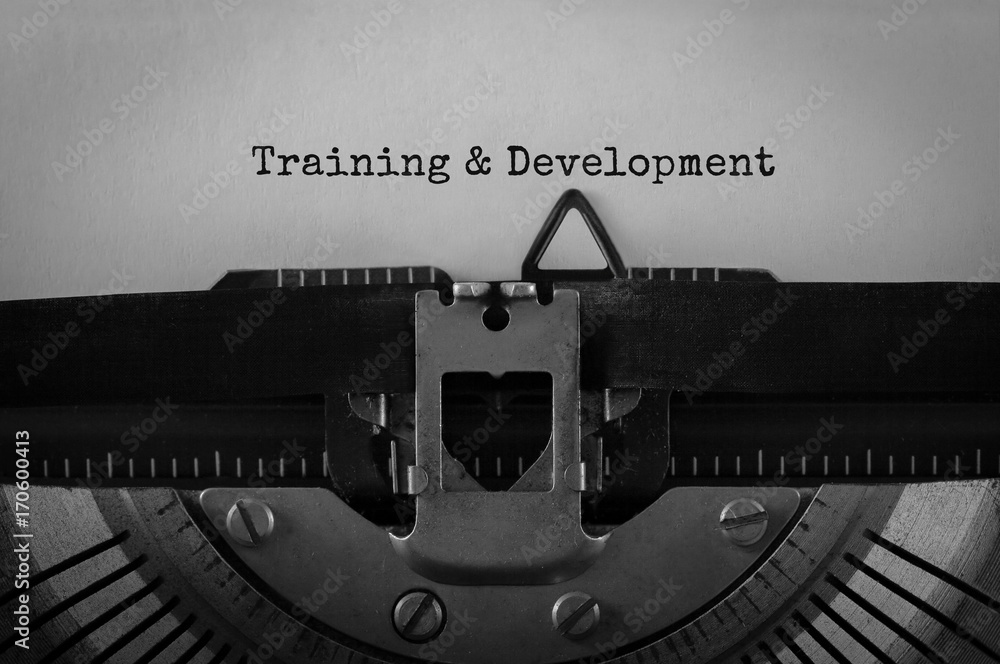 Aufkleber Text Training and Development typed on retro typewriter