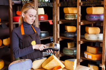 Female shop assistant with credit card machine
