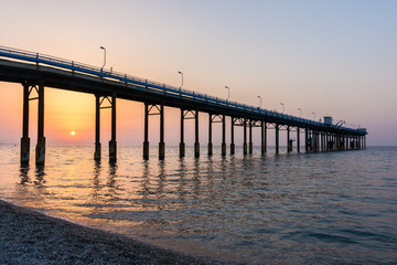 Fototapeta na wymiar Wonderful seascape of a Pier in the sunrise.